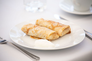 Russian pancakes with sour cream