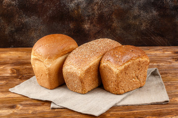 Loafs of fresh bread. Healthy food and weight loss concept