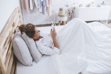 Woman Enjoying Morning in Her Bed