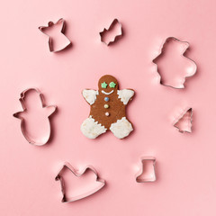 Christmas cookies various shape cutter on pink background. Top view. Flat lay. Trendy colorful photo. Minimal style with colorful paper backdrop. Christmas concept.