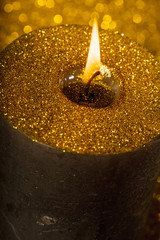 Gold christmas candle with glitter