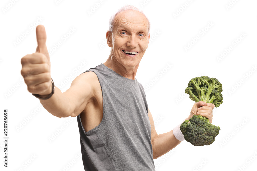 Sticker Senior man holding a broccoli dumbbell and showing thumbs up