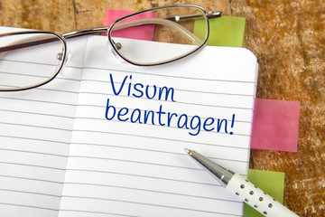 Eintrag im Notizbuch: Visum beantragen