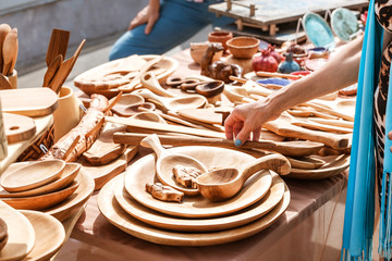 Sale of wooden handicrafts and kitchen utensils at flea market