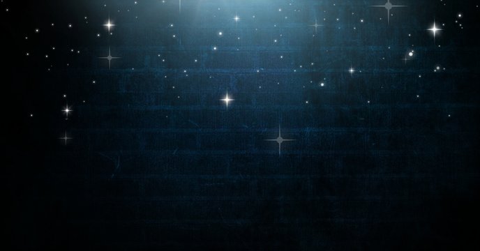 Stars glowing over Vignette and light on blue brick wall
