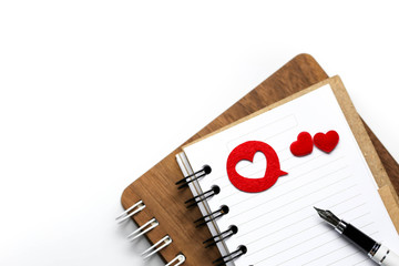 Heart with notebook and pen using for concept of Love note Day.