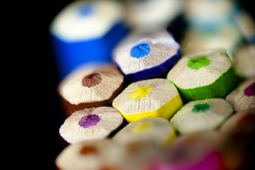 Colorful pencils - macro shot on black background