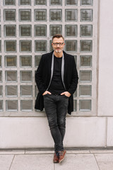 Relaxed stylish confident middle-aged businessman