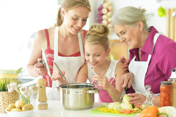Portrait of a mom and daughters cook