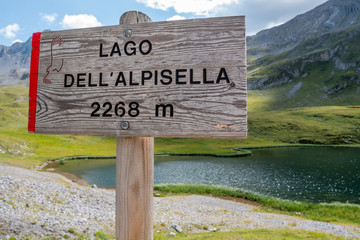 signboard along a trekking path on Alpisella lake, Stelvio National Park, Alps, Italy