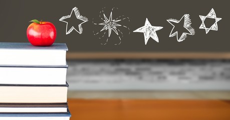 Star drawings with apple on books in school © vectorfusionart