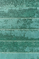 Rusty metal wall texture in green tone.