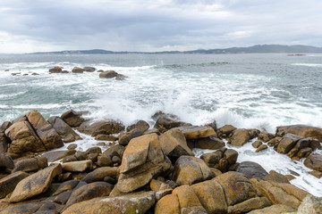 waves crashing against rocks
