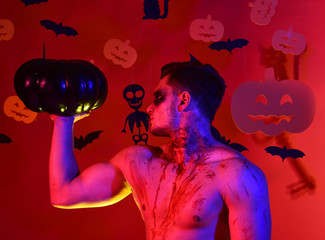 Macho with pumpkins decorations, copy space.