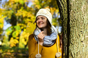 Autumn season concept. Girl in hat and scarf