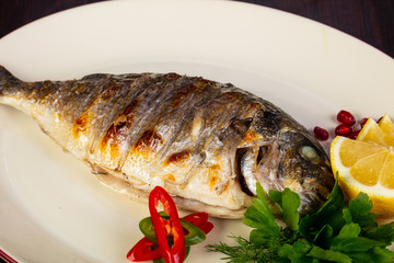 Grilled dorada served lemon