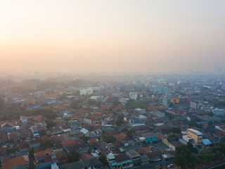 Hazy morning sky over residential complex in Tangerang, Indonesia.