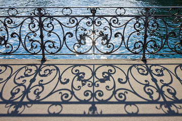 Fototapeta na wymiar Old wrought iron railing on a walkway in Lucerne (Switzerland) - image with copy space