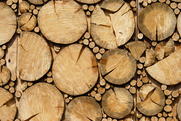 Decorative wall of sawn logs