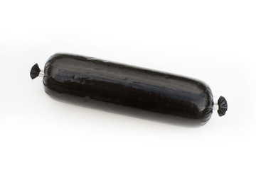 Black pudding blood sausage isolated on a white studio background.