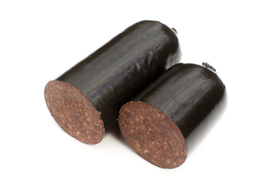 Black pudding blood sausage isolated on a white studio background.