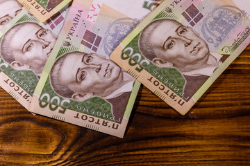 Ukrainian five hundred hryvnas banknotes on wooden table