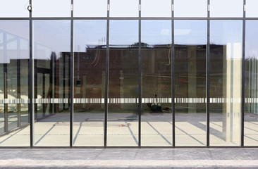 New glass windows  with reflectionsin the new city office building.