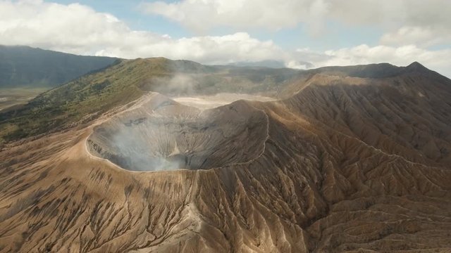 Mountain Bromo active volcano crater in East Jawa, Indonesia. Aerial view of volcano crater Mount Gunung Bromo is an active volcano,Tengger Semeru National Park. 4K video. Aerial footage.