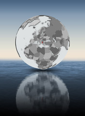 Albania on globe above water