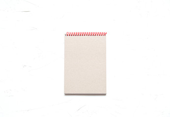 A notebook on concrete background, education ot busines concept