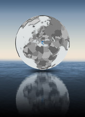 Greece on globe above water