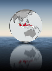 Indonesia on globe above water
