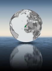 Naklejka premium Western Sahara on globe above water