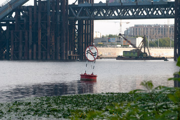 Warning buoy on the river, quiet