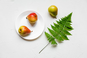 Some fresh and ripe pears on white. Flat lay