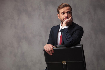 insecure businessman looks worried and pensive