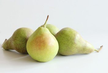 Juicy flavorful tasty pears on the white wooden background. Pear autumn harvest. Free space for text. Autumn nature concept.
