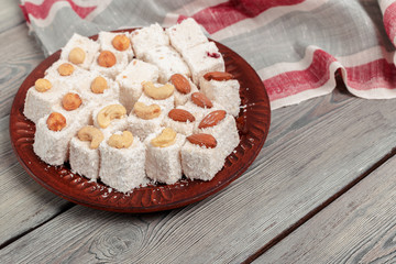 Turkish delight on a wooden table.