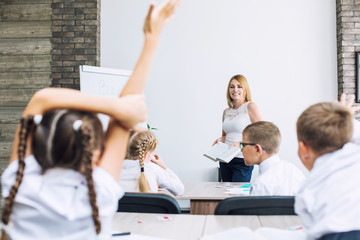 School class with students and teacher in which there is a fun informative lesson
