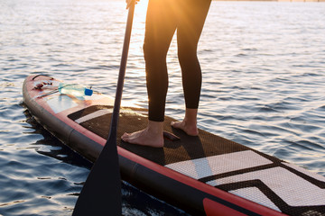 SUP Stand up paddle board woman paddle boarding