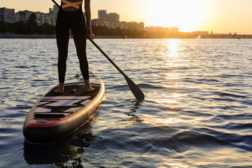 SUP Stand up paddle board woman paddle boarding