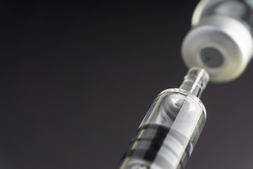 Syringe and vials closeup with selective focus and crop fragment. Medical and Healthcare Concept