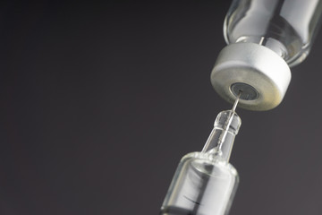 Syringe and vials closeup with selective focus and crop fragment. Medical and Healthcare Concept