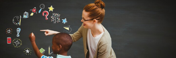 School teacher with boy and Education drawing on blackboard for