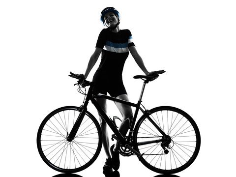 one caucasian cyclist woman cycling riding bicycle in silhouette isolated on white background