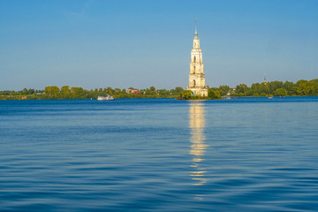 Fototapeta na wymiar Kaliazin, Russia - August, 26, 2018: bell tower of the St. Nicholas Cathedral in Kalyazin. During the construction of the dam, part of the city was flooded. Therefore, the bell tower was on the island