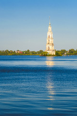 Kaliazin, Russia - August, 26, 2018: bell tower of the St. Nicholas Cathedral in Kalyazin. During the construction of the dam, part of the city was flooded. Therefore, the bell tower was on the island