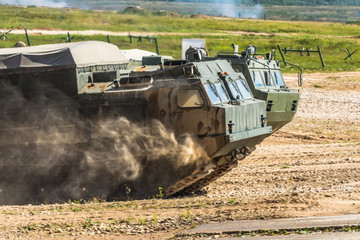 The front of the tank, riding through the dust.