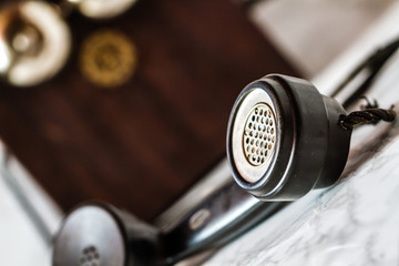 Antique Magneto Hand Crank Telephone Set on Marble Background