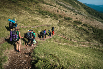 Group of hikers walking on a mountain. Carpathains, Ukraine